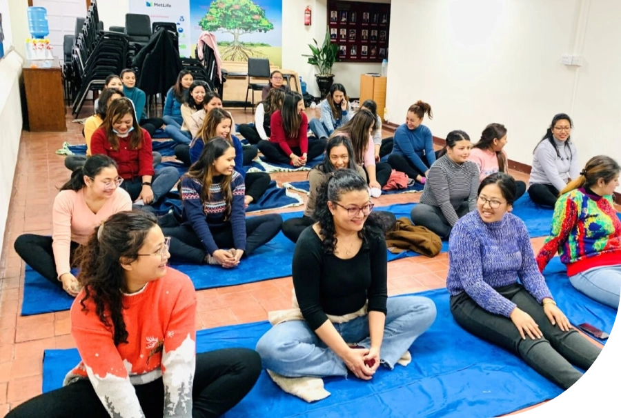 Colleagues in Nepal participate in a yoga wellness event.